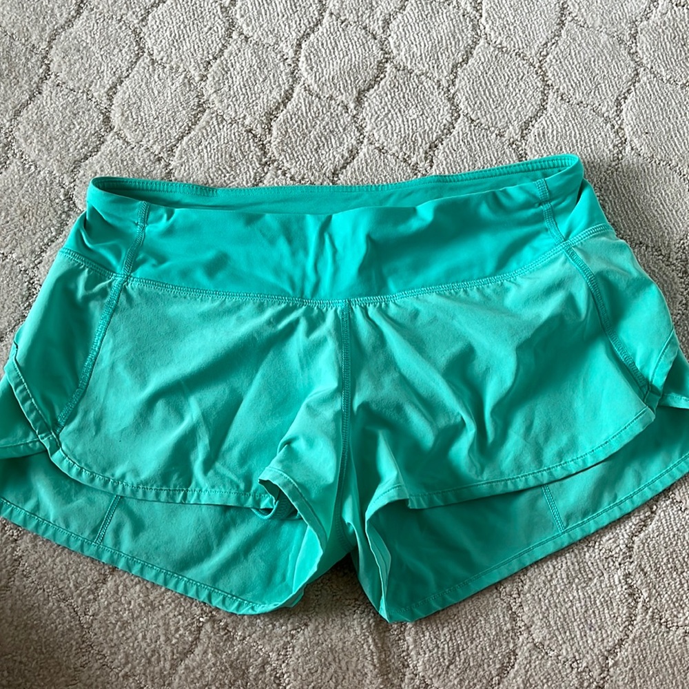 Lululemon Teal low rise speed up shorts 4” size 6